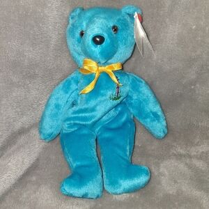 Charming Teal Teddy Bear with Golden Ribbon